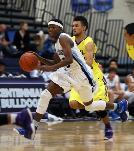 Centennial’s Isaiah Banks, left, dribbles the ball in front of Durango's Victor Ross during a basketball game at Centennial High School Friday, Dec. 12, 2014, in Las Vegas. Centennial won 6 ...