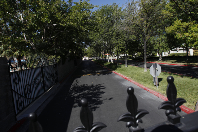 The entrance to the gated community Rancho Circle in Las Vegas is seen on Sunday, Sept. 28, 2014. The private community has been populated by rich and famous people for most of its history. (Erik  ...