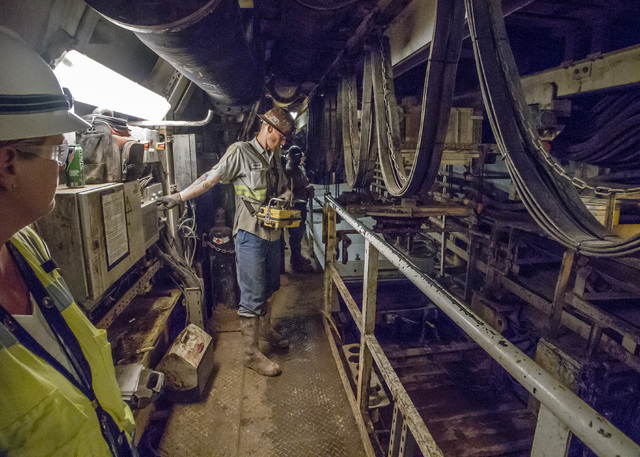 A Vegas Tunnel Constructors "shifter" operates a remote control device that moves concrete tunnel sections into place behind the boring machine during construction of the third intake tu ...