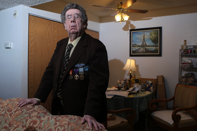 Korean War Army veteran Charles Mahoney poses for a portrait at his home in Las Vegas Thursday, Dec. 11, 2014. Mahoney is currently waiting for compensation from the U.S. Department of Veterans A ...