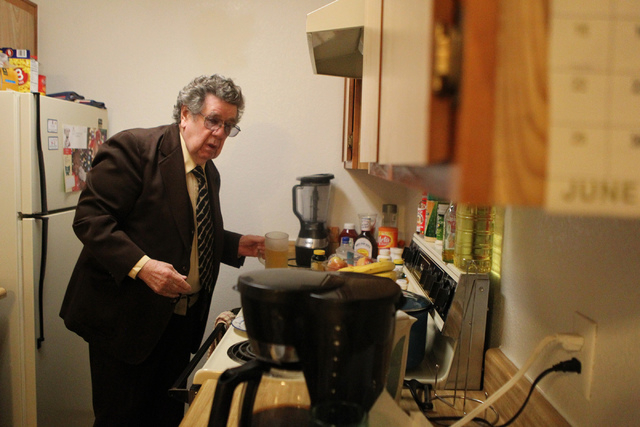 Korean War Army veteran Charles Mahoney stands in his kitchen at his home in Las Vegas Thursday, Dec. 11, 2014. Mahoney is currently waiting for compensation from the U.S. Department of Veterans ...