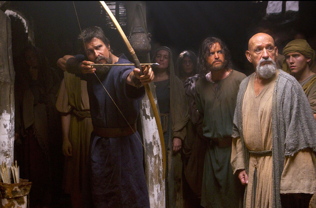 Moses (Christian Bale) displays his prowess with a bow and arrow, as Joshua (Aaron Paul, center) and Nun the scholar (Ben Kingsley) watch in "Exodus: Gods and Kings." (Courtesy Twentieth Century Fox)