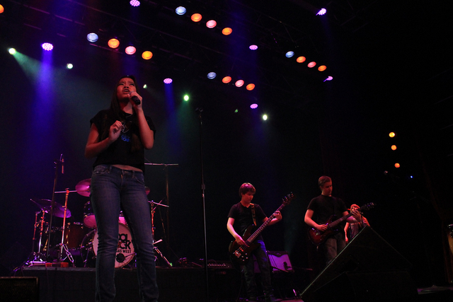 School of Rock students Natasha Romero-Salas, left, Connor Davis, center, and Alex Rea, right, perform in an AC/DC tribute show in September at the South Point. (Special to View)