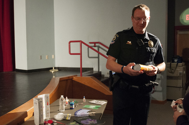 Steven Ufford, a Clark County School District Police Department officer, demonstrates how some
students use common items as drugs during a forum Nov. 13, 2013, at Western High School. (Erik Verduz ...