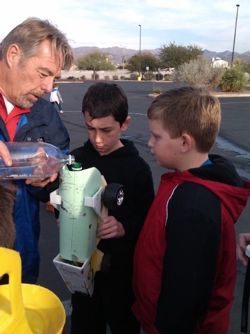 Instructor Gene Kelly helps his students test water-fueled rocket cars they designed and constructed Dec. 20. Kelly is set to teach a Creative Engineering class from 4 to 5:30 p.m. Wednesdays Jan. ...