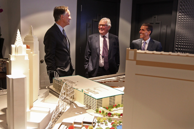 AEG Senior Vice President Mark Faber, left, shows off a model of the new Las Vegas Arena, not pictured, to businessman Bill Foley and Maloof family associate Tony Guanci Thursday, Jan. 15, 2015 at ...