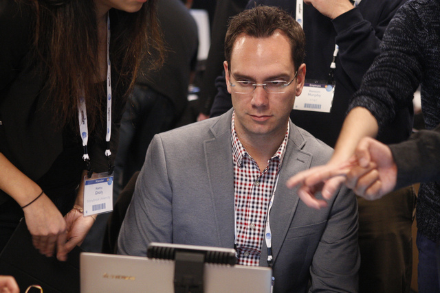Brian Greaves judges a team's technology during the 2015 AT&T Hackathon competition at the Palms casino-hotel in Las Vegas Sunday, Jan. 4, 2015. (Erik Verduzco/Las Vegas Review-Journal)