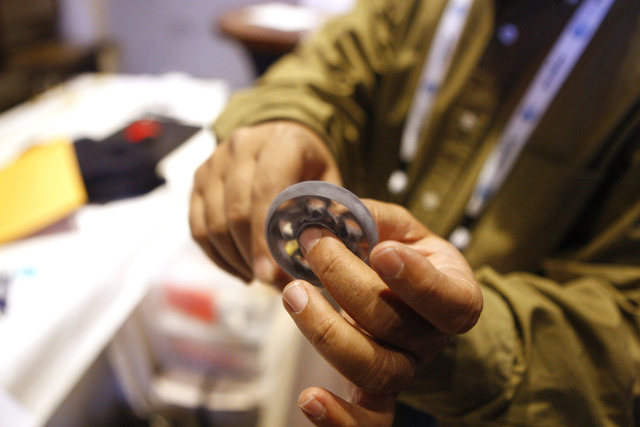 Ravindra Kondagunta shows a functional bearing made using one of his portable 3D printers during the 2015 AT&T Hackathon competition at the Palms casino-hotel in Las Vegas Sunday, Jan. 4, 2015. (E ...