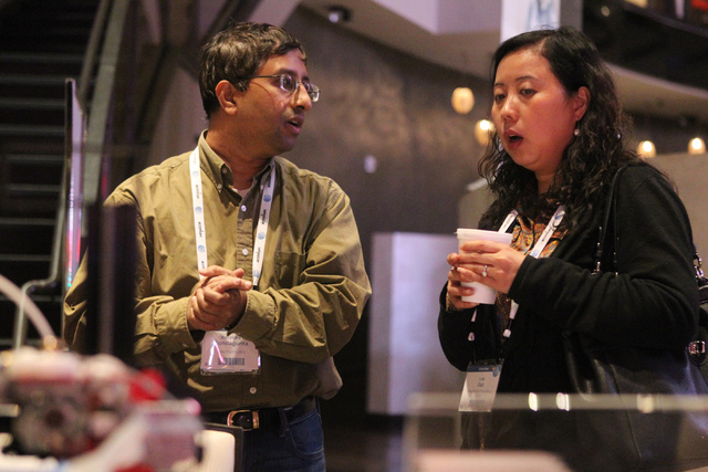 Ravindra Kondagunta, left, speaks to Lisa Gao about his portable 3D printer technology during the 2015 AT&T Hackathon competition at the Palms casino-hotel in Las Vegas Sunday, Jan. 4, 2015. (Erik ...
