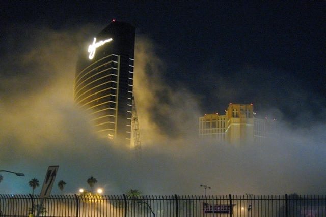 Smoke and dust shroud the Wynn Hotel-Casino across Las Vegas Boulevard after the implosion of the New Frontier Hotel-Casino on Tuesday, Nov. 13, 2007. (Mark Damon/Special to the Las Vegas Review-J ...