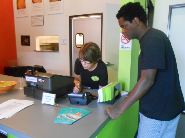 Marje Hammond and her partner, Feliciano Savilengo, process an order Nov. 14, 2014, at Pie Me Over. (Jan Hogan/View)