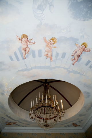 Liberace had commissioned a ceiling mural in the master bedroom and bath. The bath mural features cherubs, clouds and an image of Liberace. Additionally, a mirrored floor-to-ceiling fireplace is o ...