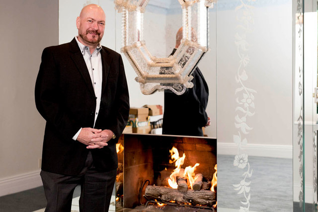 United Kingdom businessman Martyn Ravenhill stands in front of a mirrored fireplace in the master suite of the Liberace's old Las Vegas home, which he purchased for $500,000 in 2013. (Tonya Harvey ...