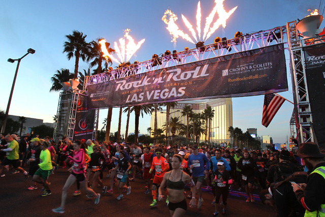 A group of runners cross the start line in the Rock 'n' Roll Las Vegas  Marathon and half marathon on the Strip on Sunday, Nov. 16, 2014. (K.M.  Cannon/Las Vegas Review-Journal) |