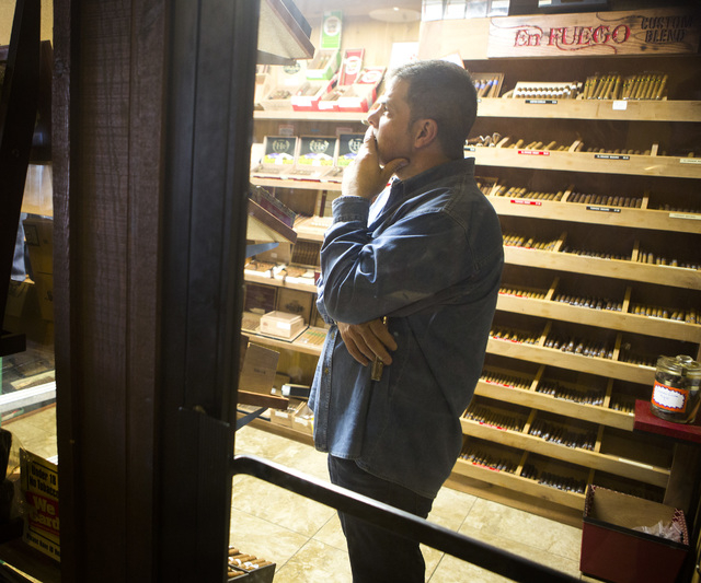 Michael Abdoulah, owner of  En Fuego Cigars & Lounge, 328 West Sahara Avenue, stands in a humidor on Wednesday, Jan. 28, 2015. Gov. Brian Sandoval is proposing to raise taxes on tobacco.(Jeff Sche ...