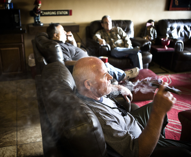 James Berns relaxes with a cigar Wednesday, January 28, 2015 at En Fuego Cigars & Lounge, 328 West Sahara Avenue. Gov. Brian Sandoval is proposing to raise taxes on tobacco.(Jeff Scheid/Las Vegas  ...