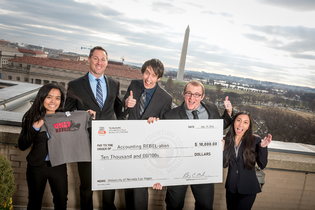 Members of the accounting REBEL-ation team display earnings after winning the American Institute of CPAs Accounting Competition in Washington, D.C. From left, Annegenelle Figueroa, faculty adviser ...