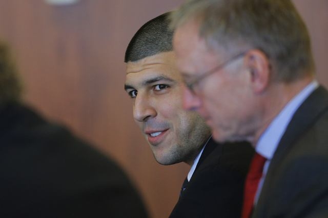 Former New England Patriots tight end Aaron Hernandez smiles during a pre-trial hearing in Fall River, Massachusetts December 22, 2014. Hernandez is awaiting trial on charges of murdering semi-pr ...