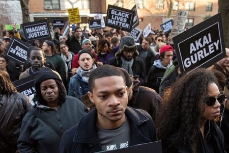 Protesters, demanding justice for Akai Gurley, march toward New York Police Department's 75th Precinct from the site of his shooting death in Brooklyn, New York, Dec. 27, 2014. (Reuters/Stephanie ...