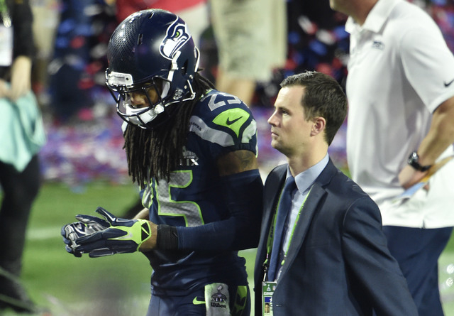 Feb 1, 2015; Glendale, AZ, USA; Seattle Seahawks cornerback Richard Sherman (25) walks off the field after the game against the New England Patriots in Super Bowl XLIX at University of Phoenix Sta ...