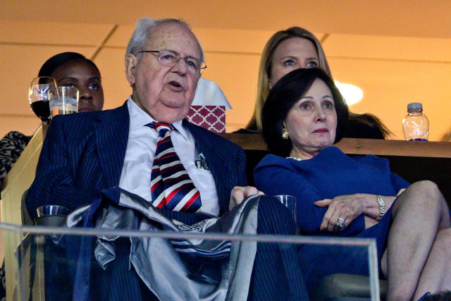 Feb 2, 2015; New Orleans, LA, USA; New Orleans Pelicans and New Orleans Saints owner Tom Benson and his wife Gayle Benson watch from the owners suite during the second quarter of a game against th ...