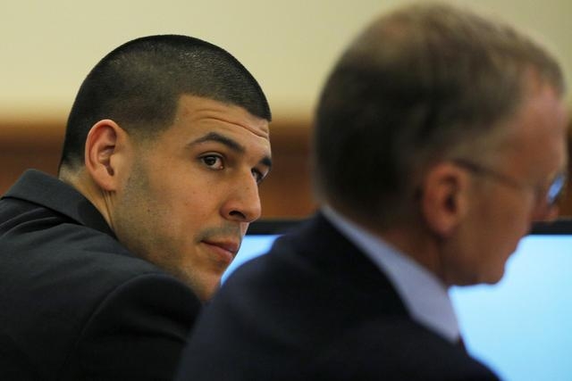 Former New England Patriots tight end Aaron Hernandez (L) and his attorney Charles Rankin listen to testimony during Hernandez' murder trial at Bristol County Superior Court in Fall River, Massach ...