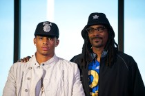 Recording artist Snoop Dogg stands beside his son Cordell Broadus who announced his commitme ...