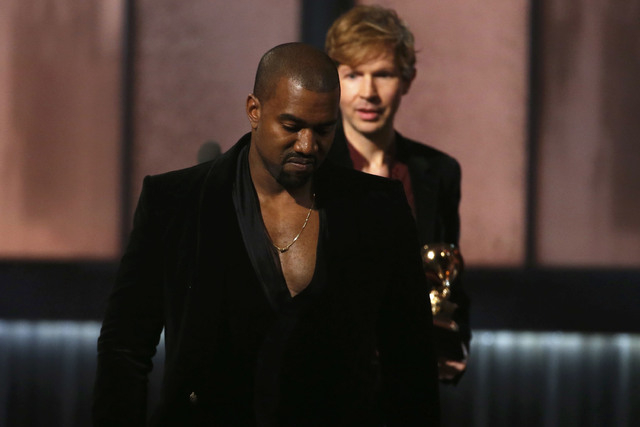 Beck watches Kanye West, who pretended to take the stage after Beck won album of the year for "Morning Phase," at the 57th annual Grammy Awards in Los Angeles, California February 8, 2015.   REUTE ...