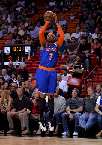 Feb 9, 2015; Miami, FL, USA; New York Knicks forward Carmelo Anthony (7) makes a three point basket during the first half against the Miami Heat at American Airlines Arena. (Steve Mitchell-USA TOD ...