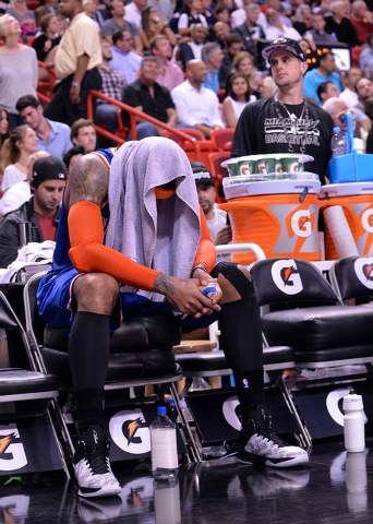 Feb 9, 2015; Miami, FL, USA; New York Knicks forward Carmelo Anthony (7) sits on the bench during the second half against the Miami Heat at American Airlines Arena. Miami won 109-95. (Steve Mitche ...