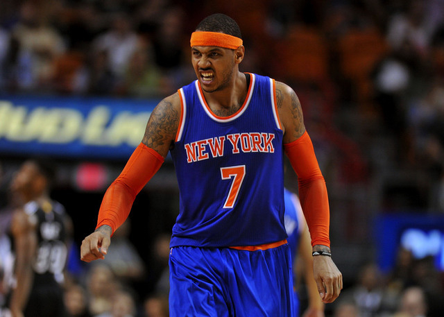 Feb 9, 2015; Miami, FL, USA; New York Knicks forward Carmelo Anthony (7) reacts after injuring himself during the second half against the Miami Heat at American Airlines Arena. Miami won 109-95. ...
