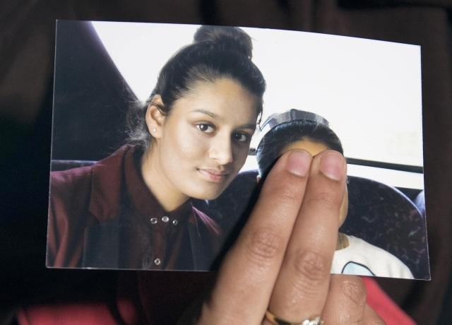 Renu Begun, sister of teenage British girl Shamima Begun, holds a photo of her sister as she makes an appeal for her to return home at Scotland Yard, in London, Feb. 22, 2015. Shamima Begun is one ...