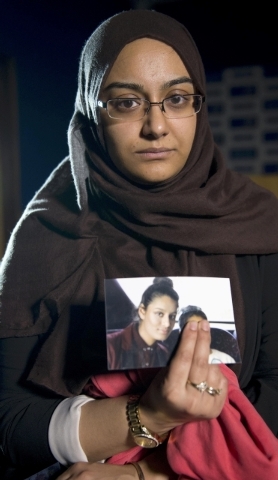 Renu Begun, sister of teenage British girl Shamima Begun, holds a photo of her sister as she makes an appeal for her to return home at Scotland Yard, in London, Feb. 22, 2015. Shamima Begun is one ...