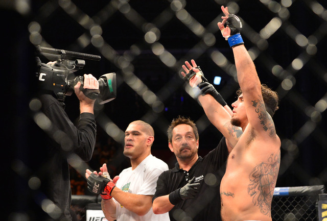 Frank Mir, right, is declared the winner after knocking out Antonio Silva, left, in the first round of UFC Fight Night on Sunday in Porto Alegre, Brazil. It was his first win since 2011. (Jason da ...