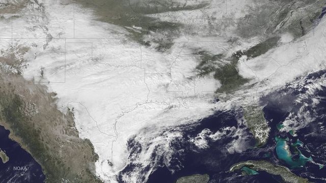 The weather system bringing winter weather to parts of the western and southern U.S. is seen in a NOAA GOES East satellite image taken at 2:45pm ET (19:45GMT) February 23, 2015.  REUTERS/NOAA/Hand ...