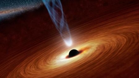 An artist's illustration shows a supermassive black hole with millions to billions times the mass of our sun at the center, surrounded by matter flowing onto the black hole in what is termed an ac ...