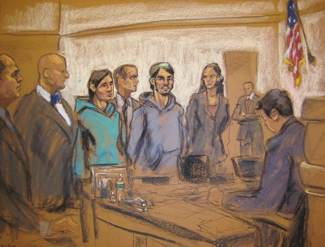 Akhror Saidakhmetov, third from left, and Abdurasul Hasanovich Juraboev, fourth from right, appear with court interpreter Akhror Saidakmetov, center, in Brooklyn federal court in New York, Thursda ...