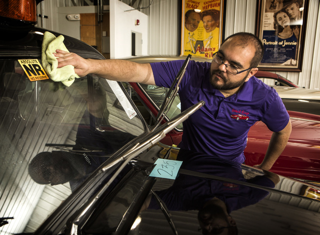 Steven Eckhouse details a 1972 Austin FX4 London Taxi at the Rogers' Classic Car Museum, 1480 Gragson Avenue, on Tuesday, Feb. 3, 2015. (Jeff Scheid/Las Vegas Review-Journal)