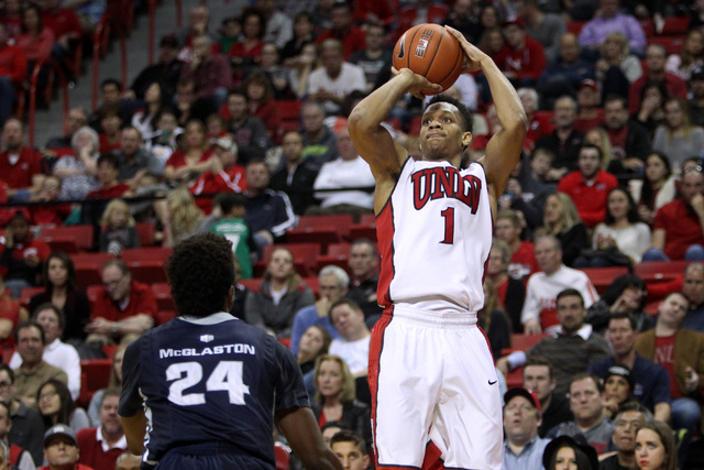 UNLV guard Rashad Vaughn takes a shot over Utah State forward Jojo McGlaston during the second half of their Mountain West Conference game Saturday, Jan. 24, 2015, at the Thomas & Mack Center. Vau ...