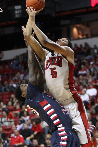 UNLV forward Christian Wood shoots over the top of Fresno State forward Alex Davis during the second half of their Mountain West Conference game Tuesday, Feb. 10, 2015, at the Thomas & Mack Center ...