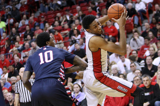 UNLV forward Christian Wood makes his move around Fresno State forward Alex Davis during the second half of their Mountain West Conference game Tuesday, Feb. 10, 2015, at the Thomas & Mack Center. ...
