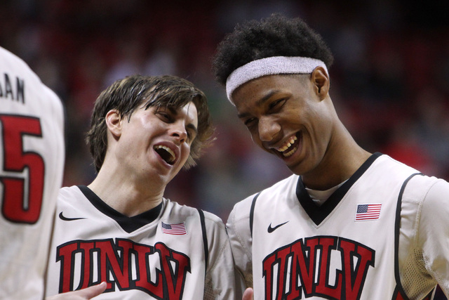 UNLV guard Cody Doolin and UNLV guard Patrick McCaw joke during a timeout the second half of their Mountain West Conference game Tuesday, Feb. 10, 2015, at the Thomas & Mack Center. UNLV won 73-6 ...