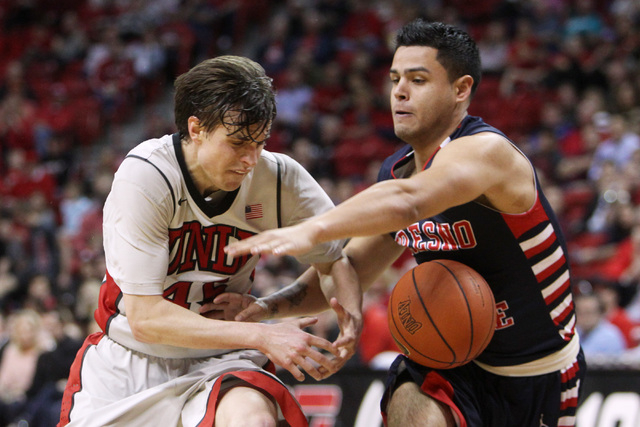 Fresno State guard Cezar Guerrero strips the ball from UNLV guard Cody Doolin during the second half of their Mountain West Conference game Tuesday, Feb. 10, 2015, at the Thomas & Mack Center. UNL ...