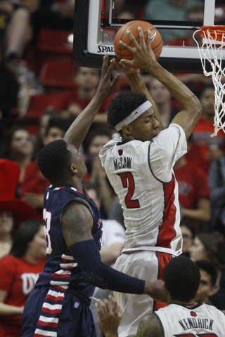 UNLV guard Patrick McCaw grabs a rebound from Fresno State forward Jerrod Patton during the first half of their Mountain West Conference game Tuesday, Feb. 10, 2015, at the Thomas & Mack Center. ( ...