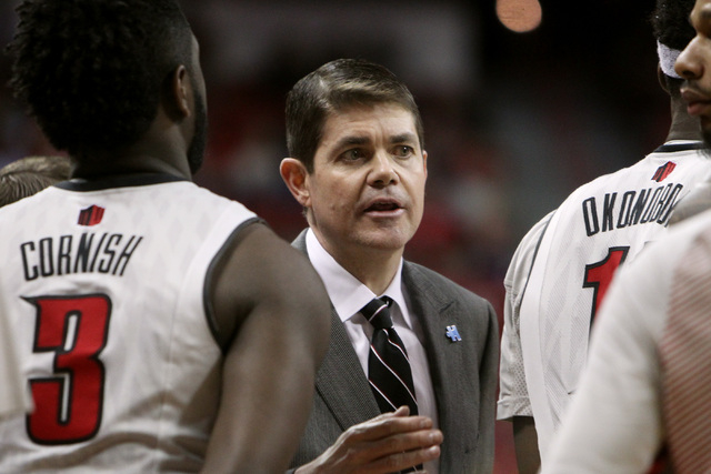 UNLV head coach Dave Rice talks to his players during the second half of their Mountain West Conference game against Fresno State Tuesday, Feb. 10, 2015, at the Thomas & Mack Center. UNLV won 73-6 ...