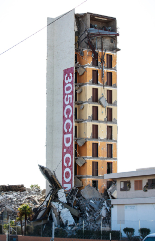 A portion of the structure of The Clarion Hotel and Casino remains following an early-morning implosion at 305 Convention Center Drive in Las Vegas on Tuesday, Feb. 10, 2015. Crews are preparing t ...