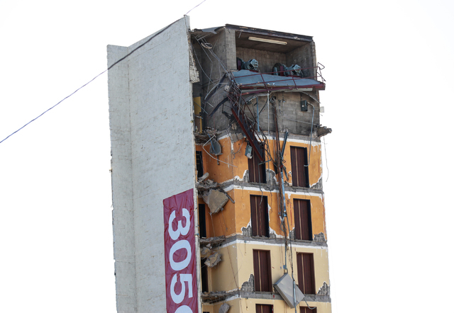 A portion of the structure of The Clarion Hotel and Casino remains following an early-morning implosion at 305 Convention Center Drive in Las Vegas on Tuesday, Feb. 10, 2015. Crews are preparing t ...