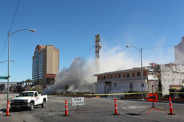 Most of remaining portion of The Clarion hotel-casino is brought down by a demolition crew after an early-morning implosion failed to fully bring down the building at 305 Convention Center Drive i ...