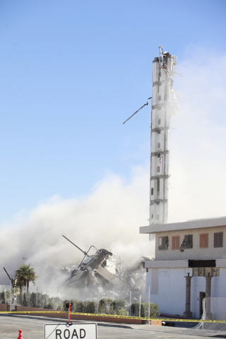 Most of remaining portion of The Clarion hotel-casino is brought down by a demolition crew after an early-morning implosion failed to fully bring down the building at 305 Convention Center Drive i ...