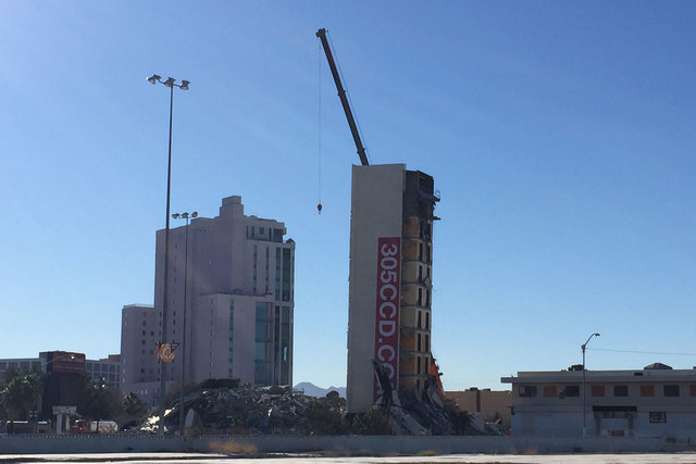 A crane was brought in Tuesday, Feb. 10, 2015, after the elevator shaft of the Clarion Hotel and Casino failed to fall during the early morning implosion of the building. (Chase Stevens/Las Vegas ...